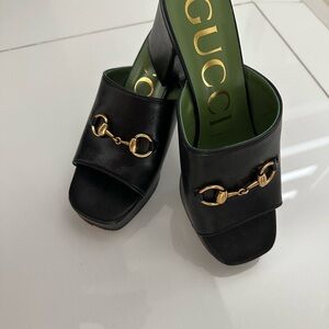 Gucci Black Leather Mules with Gold Detail